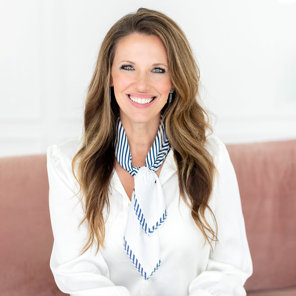 Navy and White French Silk Scarf on woman on pink couch