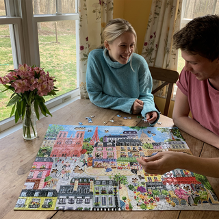 Couple completing Paris in a Day Hand-drawn 1000 piece puzzle